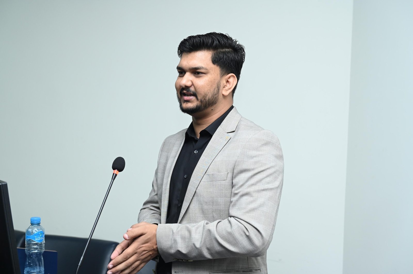 Mehboob Alam speaking at a professional conference
